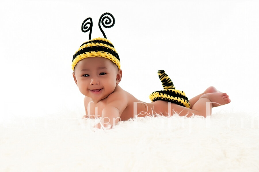 Four month old in bumble bee costume.